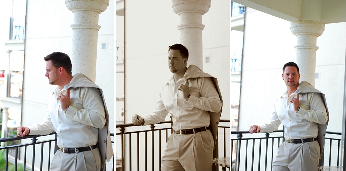 Groom looks over balcony and waits for lovely bride