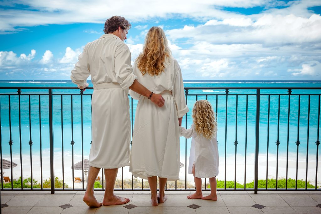 Family enjoys ocean balcony views at Beaches Resorts