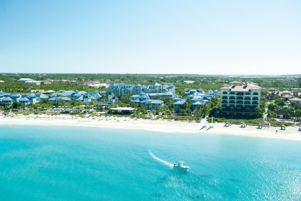 View of the 12 mile beach, turquoise blue waters, and Key West Village at Beaches Turks & Caicos.